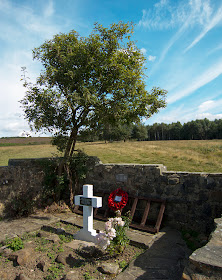 The Airman's Grave.  OFC trip to the Ashdown Forest on 6 September 2012.  On the cross: TO THE GLORIOUS MEMORY OF / SGT. P. V. R. SUTTON AGED 24 YEARS / 142 BOM. SQDN. R. A. F. / ALSO HIS FIVE COMRADES / WHO LOST THEIR LIVES HERE / THROUGH ENEMY ACTION / 11-7-41 / MOTHER    and on the wall: WELLINGTON MK2 BOMBER W5264 / IN REMEMBRANCE OF / FIRST PILOT HARRY VIDLER 27 HESSLE, HULL / SECOND PILOT VIC SUTTON 24 SIDCUP, KENT / OBSERVER WILF BROOKS 25 RAMSGATE KENT / WIRELESS OP/ ERNEST CAVE 21 WALLESEY, LIVERPOOL / AIR GUNNER STAN HATHAWAY 23 EAGLESCLIFFE, STOCKTON / REAR GUNNER LEN SAUNDERS 21 WHITSTABLE, KENT / TO LIVE IN THE HEARTS OF THOSE LEFT BEHIND / IS NOT TO DIE / 1992 