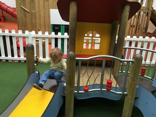 Coughs-colds-and-cakes-toddler-on-a-slide