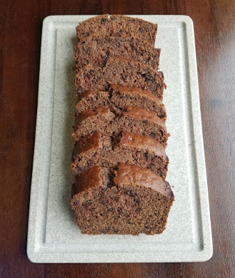 Make life a little sweeter with a loaf of sourdough chocolate banana bread. It's a fun breakfast or a great simple treat. slices of bread on cutting board