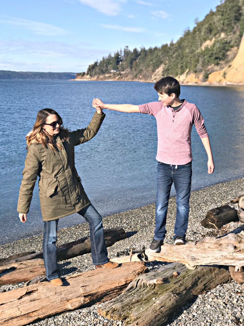mother and son on the beach in the pacific northwest