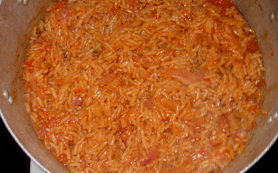 [Image: cooked+jollof+rice+waiting+to+be+mixed+with+green.jpg]