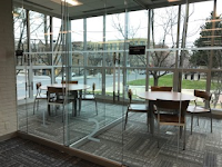 New Collaboration Spaces Tables and Chairs in the New Glassed-In Collaboration Spaces