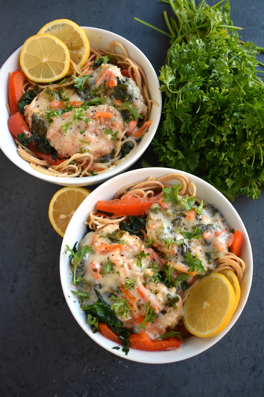  White Wine Lemon Chicken features a creamy white wine lemon sauce with spinach, carrots and red peppers served over angel hair pasta and is ready in just 15 minutes! www.nutritionistreviews.com #dinner #easydinner #chicken #pasta