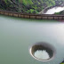 Man Notices Massive Hole In Lake, Flies His Drone Into It And Captures Incredible Footage
