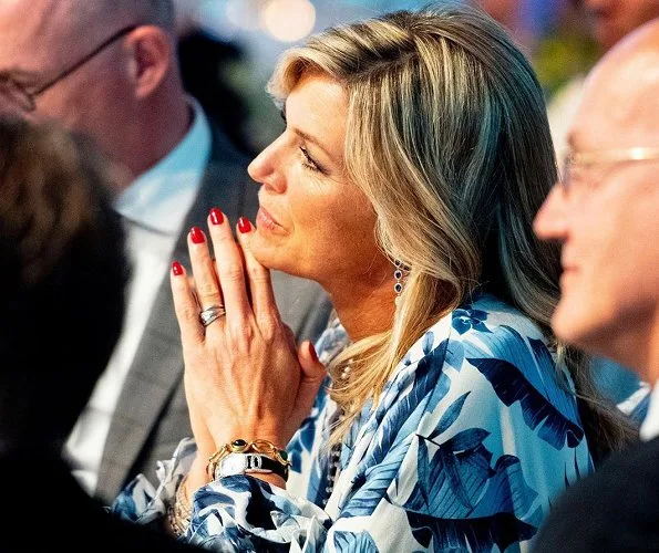 Queen Maxima wore a new royal navy crepe dress by Johanna Ortiz