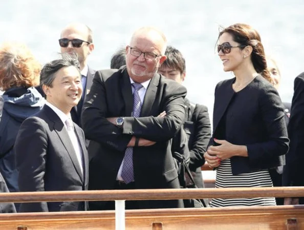 Crown Prince Naruhito of Japan on a boat trip with Crown Princess Mary of Denmark. Princess wore Prada coat and Prada skirt