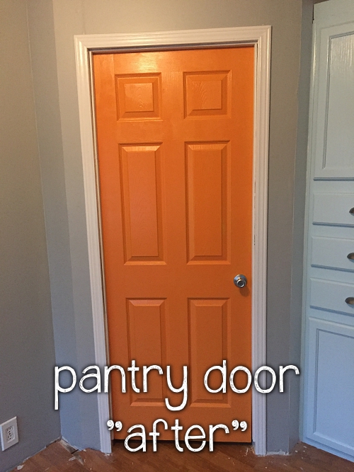 painted orange pantry door
