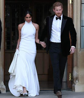 Meghan Markle is stunning in her second dress as she and her new husband head to their wedding reception (photos)
