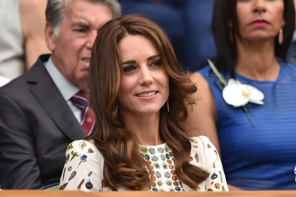 Duchess Catherine at the Men's Final of the Wimbledon. Kate Middleton wore Alexander McQueen Obsession Print Short Sleeve Dress. Brora Gold Charm Earrings, and carried her L.K. Bennett Natalie clutch.