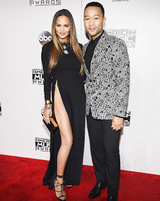 1a1a Chrissy Teigen attends the 2016 AMA in a very high slit dress and no underwear