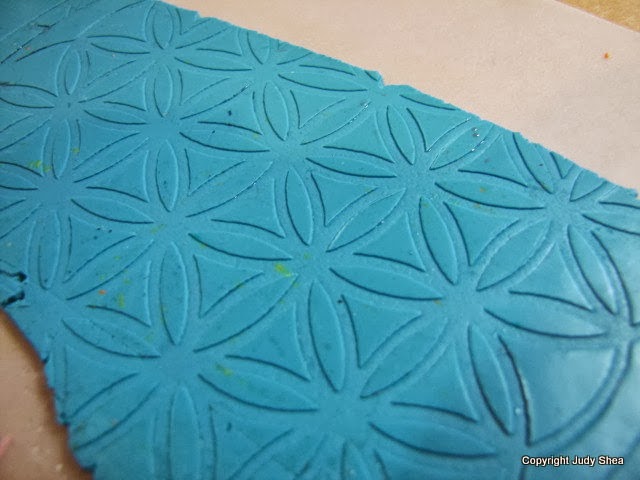 Polymer clay tutorial using stencils to make colorful bookmarks.