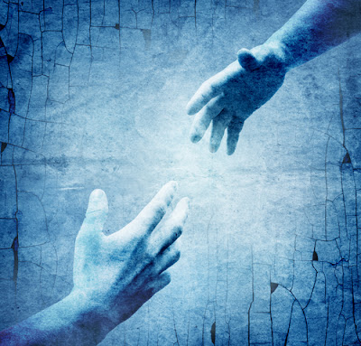 two hands reaching for each other with blue background