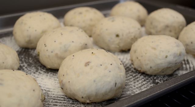 Seeded bread rolls before proving