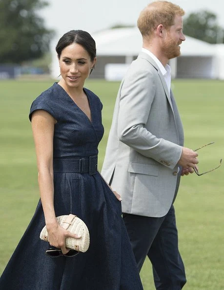 Meghan Markle wore Carolina Herrera dress, Aquazzura 'Deneuve pumps, Birks Bee Chic blue topaz earrings, Tom Ford sunglasses, carries J Crew clutch