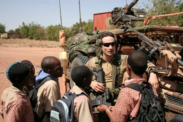 Image Attribute: A French Soldier talking with Malian Children / Source: Wikimedia Commons