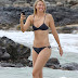 Maria Sharapova shows off fabulously toned physique in tiny black bikini as suspended tennis pro vacations in Hawaii