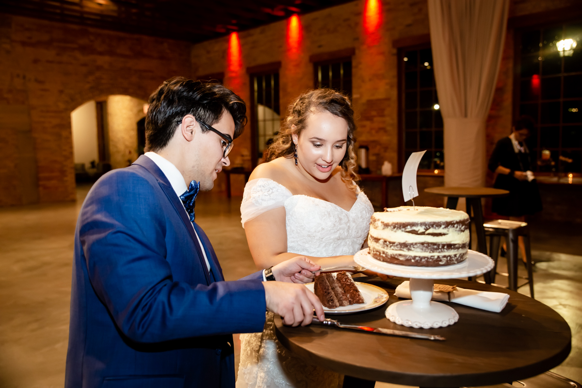 Couple sharing cakes together on their big day Couple sharing cakes together on their big day
