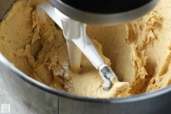 Quaker Oatmeal Cookie dough being mixed in the bowl of a stand mixer