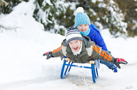 Ontario kids boys on sled - parents canada