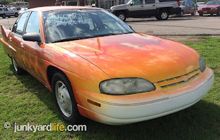 The paint on  the Chevy Lumina custom improves the hot rod look of the quite commuter car.
