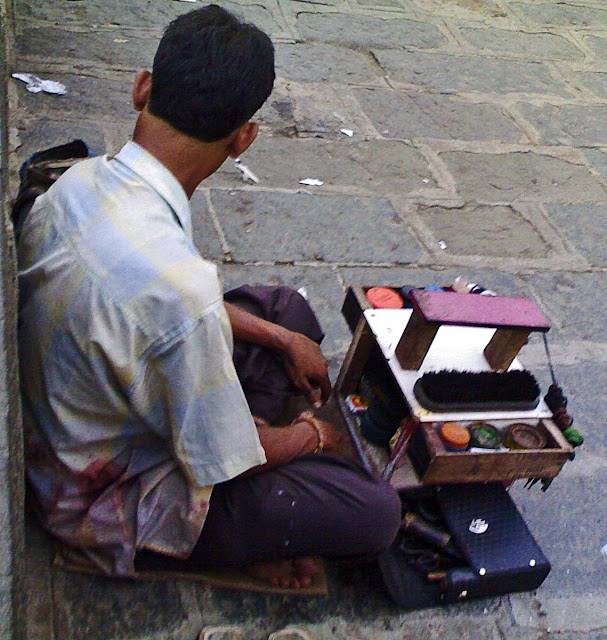shoeshine boy on pavement