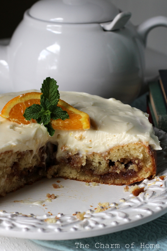 The Charm of Home Cinnamon Roll Cake with Orange Cream Cheese Icing