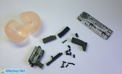 Assembling miniature toy gun that shoot 1