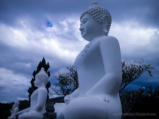 Big White Buddha Statues In The Front Of The Garden In Cloudy Sky At Buddhist Monastery Bali Indonesia