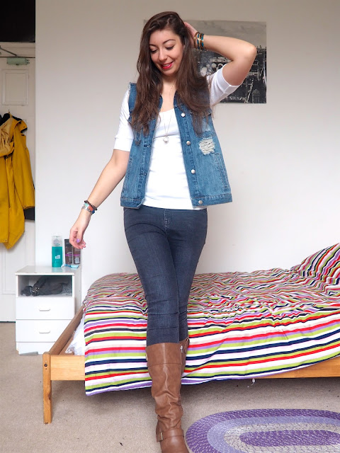 Flynn Rider Tangled Disneybound outfit - blue denim waistcoat, white top, grey skinny jeans and brown leather high heeled boots