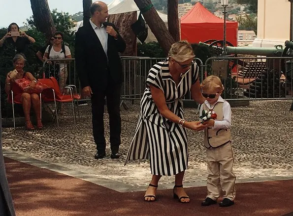 Princess Charlene wore AKRIS silk crepe striped dress and Stuart Weitzman Sandal. Princess Caroline, Beatrice Borromeo, Princess Gabriella