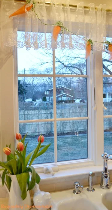 Easter Carrot Garland hanging over a kitchen window
