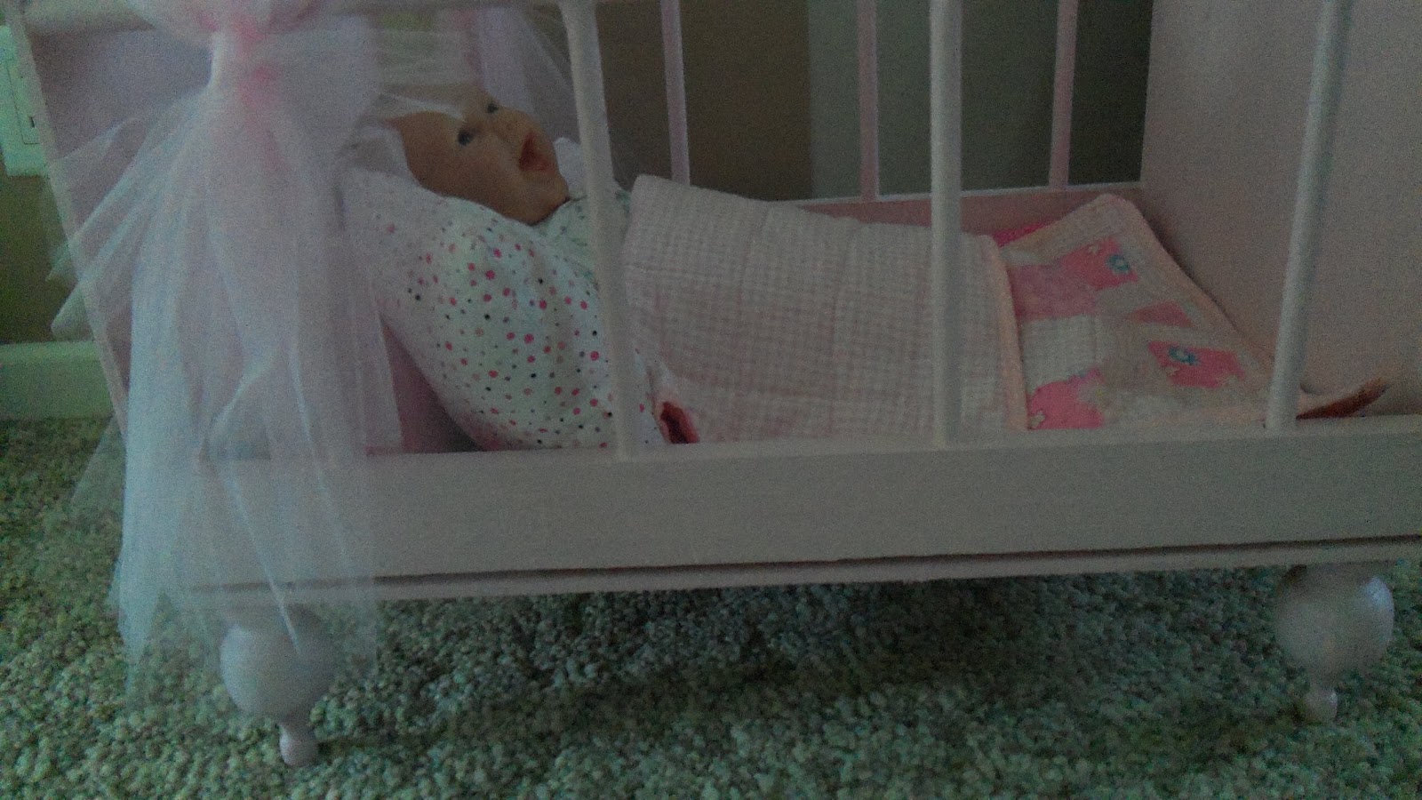 The Toney 5 baby doll bed and bedding.