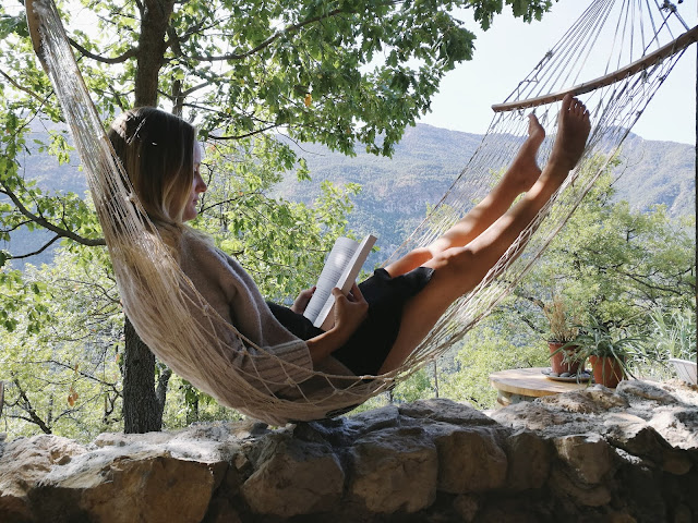 Jules in a Hammock Mama lying in a hammock reading a book