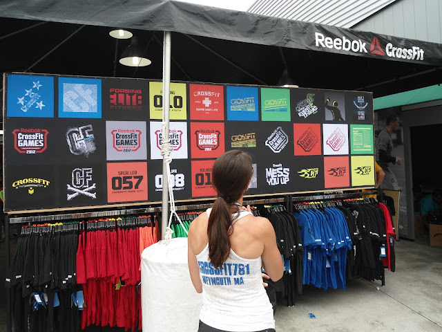 Image of a wall of t-shirts for sale at the 2012 CrossFit Games