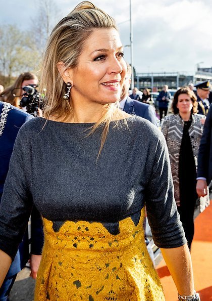 Queen Maxima's outfit is from the fashion house Natan. yellow lace skirt by Natan and grey top