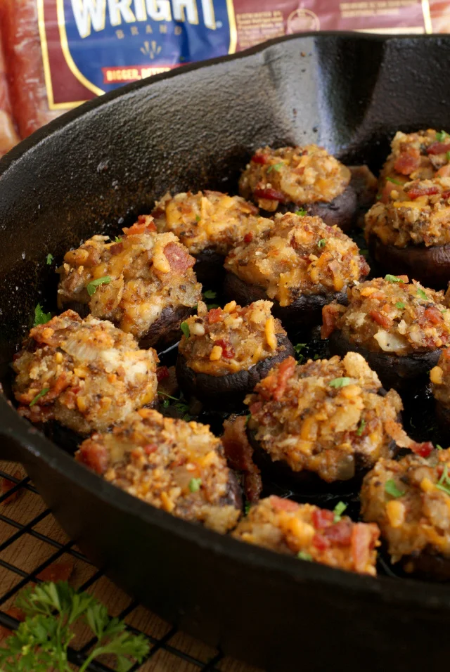 Bacon and Cheddar Stuffed Mushrooms are made by stuffing earthy cremini mushrooms with loads of thick-sliced Wright® Brand Bacon and sharp cheddar cheese, making them an irresistible appetizer for any occasion!  #VoteWrightBrandBacon #Sponsored @WrightBacon