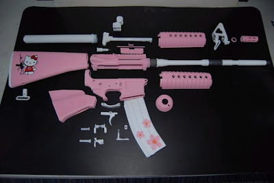 Hello Kitty pink AR-15 rifle gun parts taken apart
