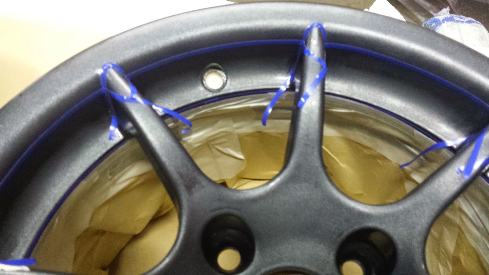 Masking around where the spokes meet the rim was apparently fiddly