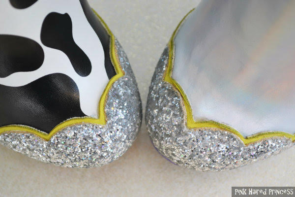 Irregular Choice You Are A Toy! toe close up aerial view of ankle boot toes one in cow print one holographic both with silver glitter trim