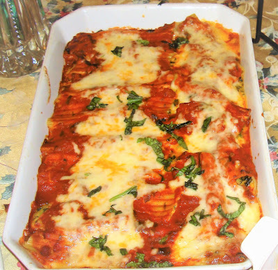 STUFFED MANICOTTI WITH SPINACH, MUSHROOMS  AND SUNDRIED TOMATOES PORTIONS: 14 MANICOTTIES INGREDIENTS 14 manicotti 3 tbsp. salted butter ½ cup small diced onions 1 minced garlic clove 1½ cup chopped mushrooms ½ cup chopped sundried tomatoes. 10 oz. chopped spinach 1 tsp. lemon juice 2 tbsp. chopped fresh basil leaves ½ tsp. salt ¼ tsp. ground black pepper 2½ cups ricotta cheese 4 tbsp. grated parmesan cheese 1 cup shredded mozzarella cheese 3 beaten eggs Tomato sauce Shredded mozzarella cheese Grated parmesan cheese METHOD Measure and cut all ingredients necessary for the recipe. In boiling salty water, half cook the manicotti for about 4 – 5 minutes. Immediately cool in cold water. Heat a frying pan with the butter and cook onions and garlic together. Add mushrooms and cook. Add sundried tomatoes and cook for 2 minutes. Add spinach lemon juice, salt and pepper and mix well. Add flour, mix well and cook for about 3 minutes. Add and mix basil leaves. Let it cool off. Mix the ricotta cheese with the 4 tbsp. Parmesan cheese, 1cup shredded mozzarella, eggs and spinach mix. With a pastry bag fill in the manicotti with the ricotta mix. Place the manicotti on a buttered baking pan. Top it with tomato sauce, shredded mozzarella and Parmesan cheese. Preheat the oven at 350° and cook until mozzarella cheese is melted and manicotti are cooked, about 15 – 20 minutes. Heat a frying pan with the butter and cook onions and garlic together. Add mushrooms and cook Add sundried tomatoes and cook for 2 minutes.  Add spinach lemon juice, salt and pepper and mix well Add flour, mix well and cook for about 3 minutes. Add and mix basil leaves. Let it cool off. Mix the ricotta cheese with the 4 tbsp. Parmesan cheese, 1cup shredded mozzarella, eggs and spinach mix. With a pastry bag fill in the manicotti with the ricotta mix. Place the manicotti on a buttered baking pan. Top it with tomato sauce, shredded mozzarella and Parmesan cheese. Preheat the oven at 350° and cook until mozzarella cheese is melted and manicotti are cooked, about 15 – 20 minutes.