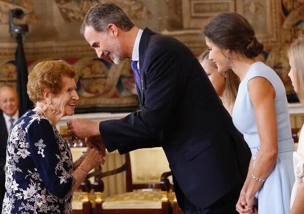 King Felipe, Princess Leonor and Infanta Sofia. Queen Letizia, blue dress, diamond bracelet, and diamond earrings