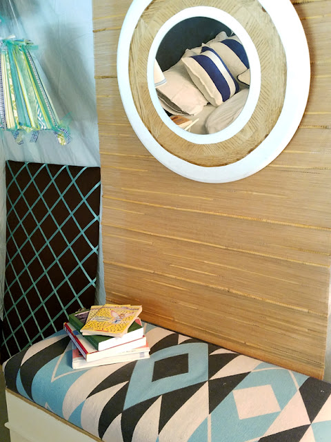 basement bedroom, southwestern bench, diy round mirror, fabric walls