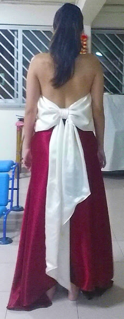 Evening Gown Back View Back view of the wine red evening gown with a huge off white ribbon bow at the back