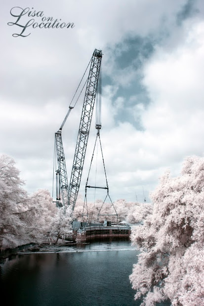 The 400-ton Submarine Theater is lifted out of Spring Lake at Aquarena Center, Texas State University-San Marcos. Infrared photo by Lisa On Location photography.