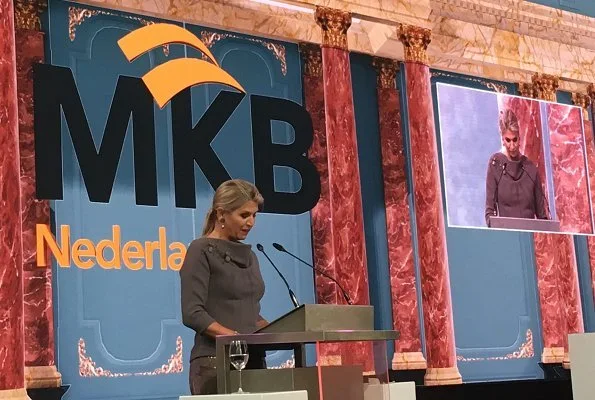 Queen Maxima gave an opening speech at the MKB Nederland congress in The Hague. Queen Maxima wore Sequin midi skirt and grey wool top