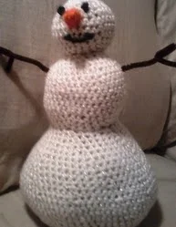 http://www.ravelry.com/patterns/library/stuffed-snowman-decor-doll