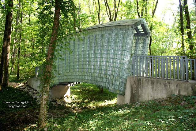 Photo of a covered walking bridge made all of glass blocks at Cheekwood garden in Nashville Tennessee.