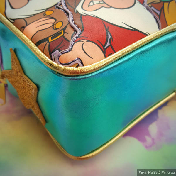 Irregular Choice Disney Fairest In The Land Bag gold piping corner of handbag close up with gold piping and turquoise metallic
