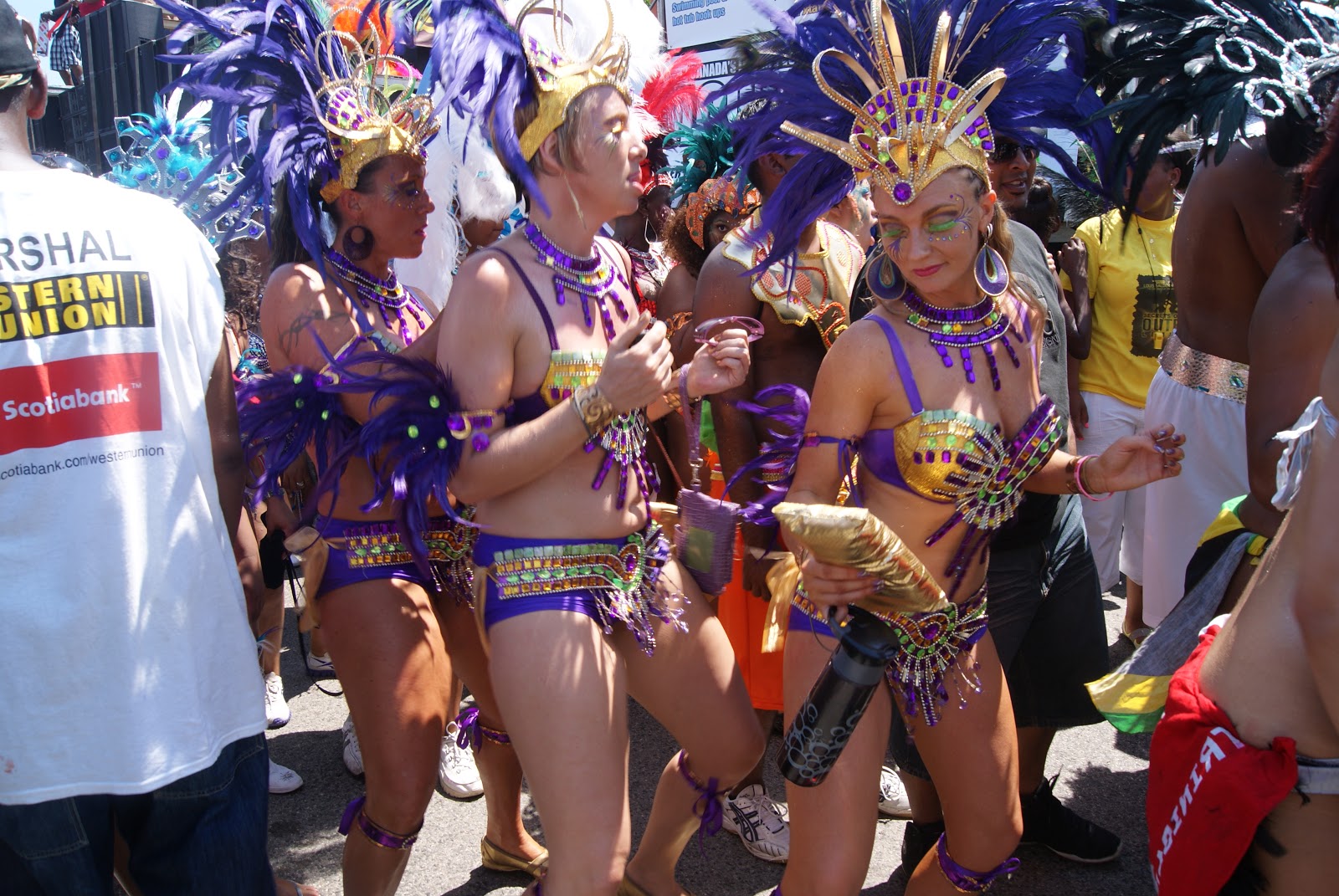 people in amazing blue and gold parade costumes 