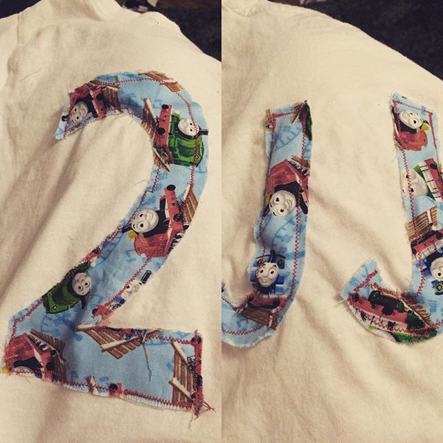 A birthday tshirt with the number 2 and JJ stitched on to it in a Thomas the tank engine fabric